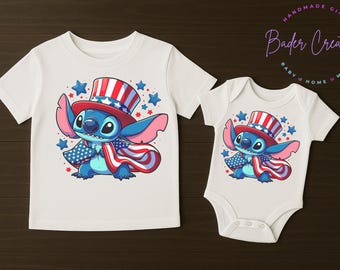 May include: White t-shirt and onesie featuring a blue cartoon character wearing a red, white, and blue hat and cape. The design includes stars and patriotic colors, perfect for a baby or toddler.