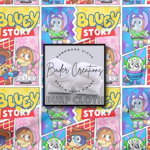 May include: Burp cloths with a colorful cartoon design featuring characters and the text "Bluey Story". The image also includes a stack of white burp cloths with the text "Bader Creations" and "Burp Cloth".
