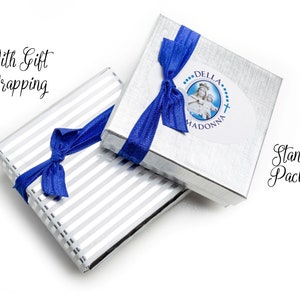 This image shows our standard silver gift box with a logo on the lid compared with the gift wrapped option with silver gift wrap paper.  Both options will come with a blue ribbon on the box.