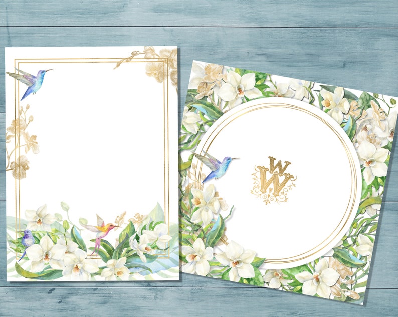 May include: Two white cards with gold frames and floral designs. The cards feature white orchids, green leaves, and blue hummingbirds. One card has a gold circle with the initials "WW" in the center.