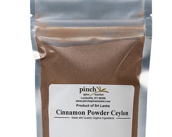 May include: A silver resealable pouch containing brown Ceylon cinnamon powder. The white label reads: pinch spice market, Louisville, KY 40206, www.pinchspicemarket.com, Product of Sri Lanka, Cinnamon Powder Ceylon, Made with Quality Organic Ingredients, NET. WT. 4 OZ.