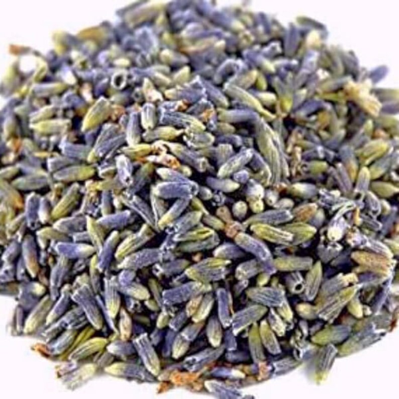 May include: A close-up of dried lavender buds, showcasing a mix of purple and green hues. The buds are tightly packed together, creating a textured appearance. This image highlights the natural beauty of the lavender.