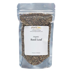 May include: A resealable pouch filled with dried organic basil leaf. The pouch is labeled "Pinch Spice Market" and "Organic Basil Leaf". The label also states "Product of Albania".