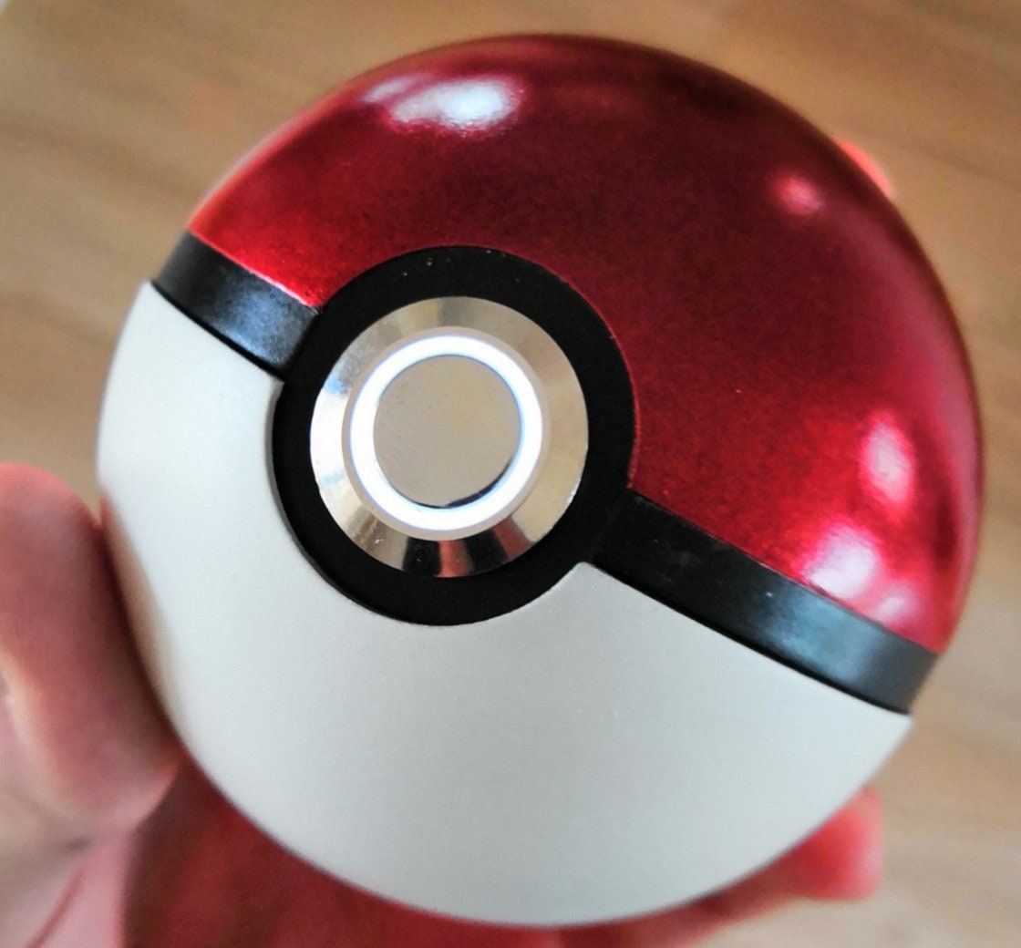 Pokemon video gaming championship, pokeball, red blue and white vortex of 3  pokemons going around the pokeball, realistic lighting, vibrant colors,  mirror sine on the pokeball, volume and depth