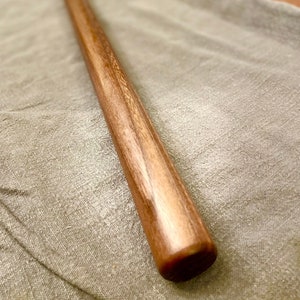 Straight rolling pin that is non tapered sometimes called a dowel rolling pin