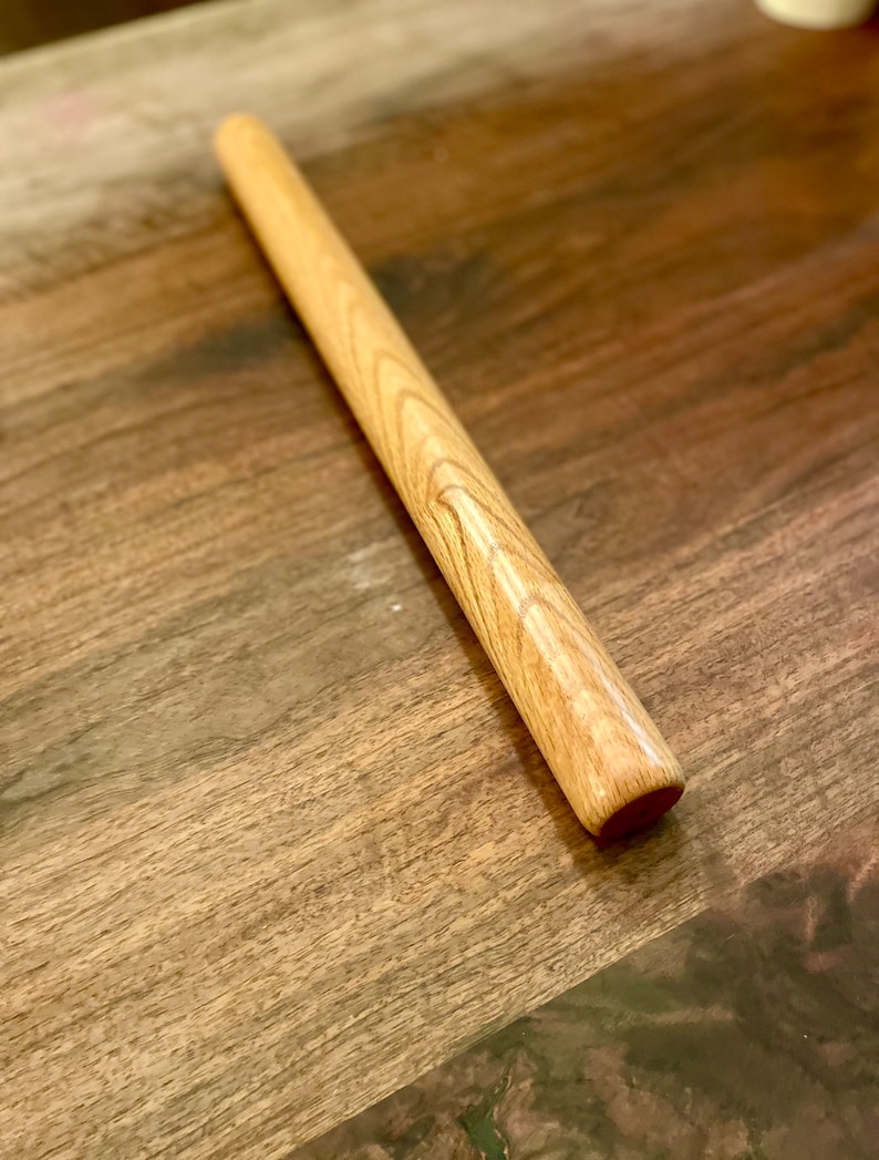 Straight rolling pin that is non tapered sometimes called a dowel rolling pin