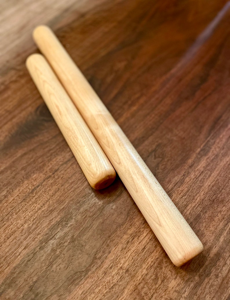 Straight rolling pin that is non tapered sometimes called a dowel rolling pin