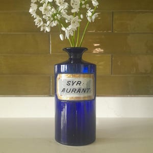 Antique cobalt blue glass apothecary bottle