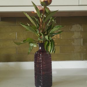 Hand-blown purple glass bottle vase