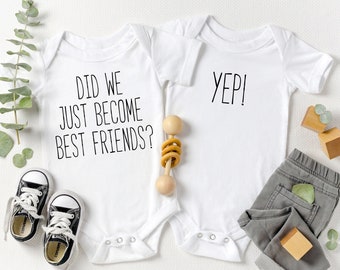 May include: Two white baby onesies with black text. One onesie says "Did we just become best friends?" and the other says "Yep!"
