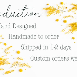 May include: White background with yellow flowers scattered around the text "Production", "Hand Designed", "Handmade to order", "Shipped in 1-2 days", and "Custom orders welcome!" with a small bee logo with the letters "LB" at the bottom.