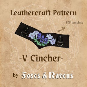 May include: Leathercraft pattern for a V cincher with a floral design featuring white and purple flowers on a brown leather background. The pattern is a PDF template by Foxes & Ravens.