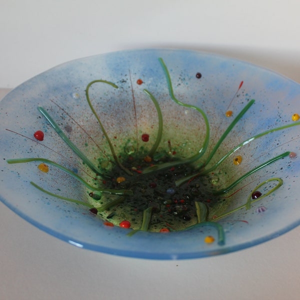 Large flower bowl in fused glass. Blues, greens and red. Ideal as a fruit bowl or just for display.