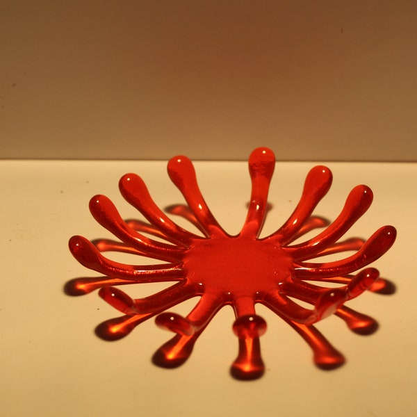 tealight holder, organic shape in transparent orange and opaque green.