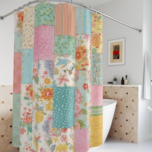 May include: A patchwork shower curtain featuring a mix of floral and patterned fabric squares in pastel shades. The curtain is suspended from a curved, chrome-coloured rail, adding a decorative element to the bathroom.
