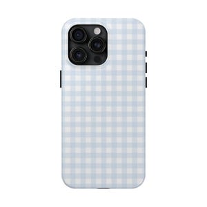 May include: A light blue and white checkered phone case for an iPhone.