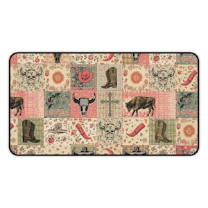 May include: A rectangular mat with a patchwork design featuring cowboy boots, hats, skulls, and a cross. The color palette includes beige, pink, green, and red, with floral and sun motifs. The mat has a black border.