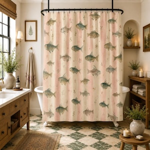 May include: A shower curtain featuring a repeating pattern of various fish illustrations in muted tones of blue and green, set against a background of vertical stripes in alternating shades of cream and soft pink with small floral accents.