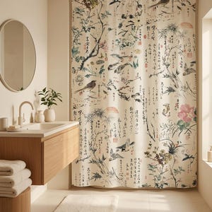 May include: A shower curtain featuring a cream-colored background with a detailed print of birds, pine branches, and flowers in muted tones. The design includes black ink-style calligraphy and red seal stamps scattered across the fabric surface.