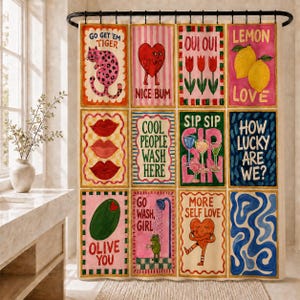 May include: A shower curtain featuring a grid of twelve colorful illustrations with text including Go Get 'Em Tiger, Nice Bum, Oui Oui, Lemon Love, Cool People Wash Here, Sip Sip, How Lucky Are We, Olive You, Go Wash Girl, and More Self Love.