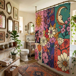 May include: A colorful shower curtain with a retro floral design. The curtain features a sun, moon, and various flowers in shades of pink, orange, yellow, and green. The bathroom has a vintage aesthetic with framed mirrors and plants.