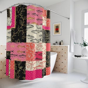 May include: A patchwork shower curtain with a repeating pattern of fish illustrations, floral designs, and polka dots. The colour scheme includes black, pink, gold, and cream. The curtain is hanging in a bathroom.