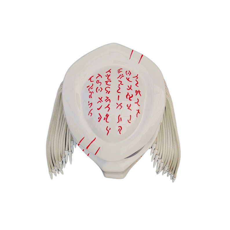 May include: A white Predator mask with red markings and dreadlocks. The mask has a smooth, glossy finish and features intricate red symbols across the top. The dreadlocks are a light beige color, adding contrast to the white mask.