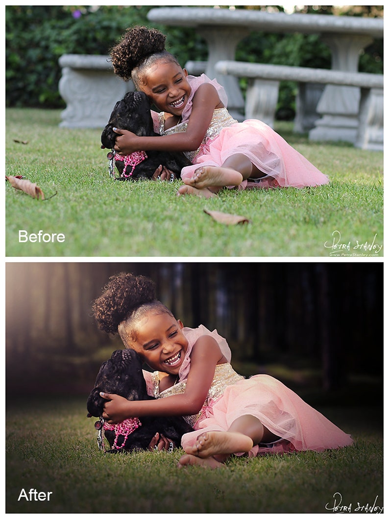 May include: A young girl with curly hair is laughing while hugging a black dog. The girl is wearing a pink dress and the dog is wearing a pink collar with a sparkly charm. They are both lying on green grass.