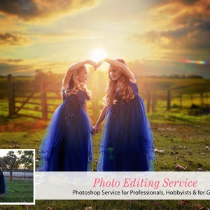 May include: Two girls in blue dresses stand in a field with a sunset in the background. They are holding hands and making a heart shape with their arms. The text "Photo Editing Service" is at the bottom of the image.