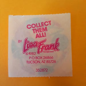 May include: A square sticker with the text "COLLECT THEM ALL!" and the Lisa Frank logo in pink. The sticker also includes the text "&copy;1982 Incorporated" and an address in Tucson, AZ. The background is yellow.