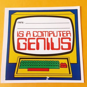 May include: A square sticker featuring a yellow vintage computer illustration with a white screen area containing the text "NAME:" followed by two lines and the red text "IS A COMPUTER GENIUS". The computer has a green keyboard and a red key.