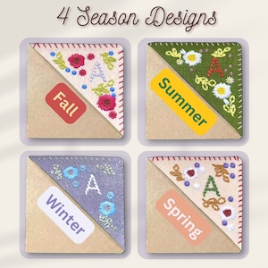 May include: Four corner bookmarks with embroidered floral designs representing the four seasons. Each bookmark has a label with the season name: Fall, Summer, Winter, Spring.