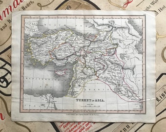 May include: An antique map of Turkey in Asia, printed on cream paper. The map shows the geographical features of the region, including rivers, mountains, and cities. The map is titled "TURKEY in ASIA." and includes a scale in British miles.