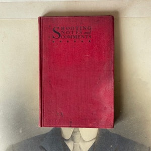 May include: A red hardcover book with the title "Shooting Notes and Comments" printed in black on the front cover.