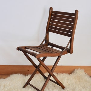 Chaise pliante en bois ancienne ,vintage image 1