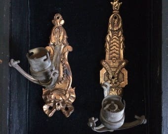 A pair of wall lights, in gilded bronze, old