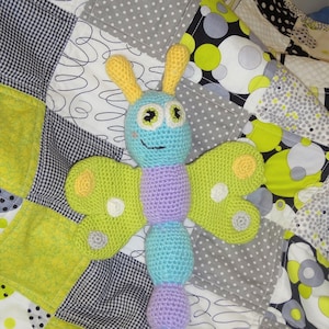 Flutterby - Crochet stuffed toy butterfly rattle/amigurumi. Blue, purple, lime green, yellow, white, and gray