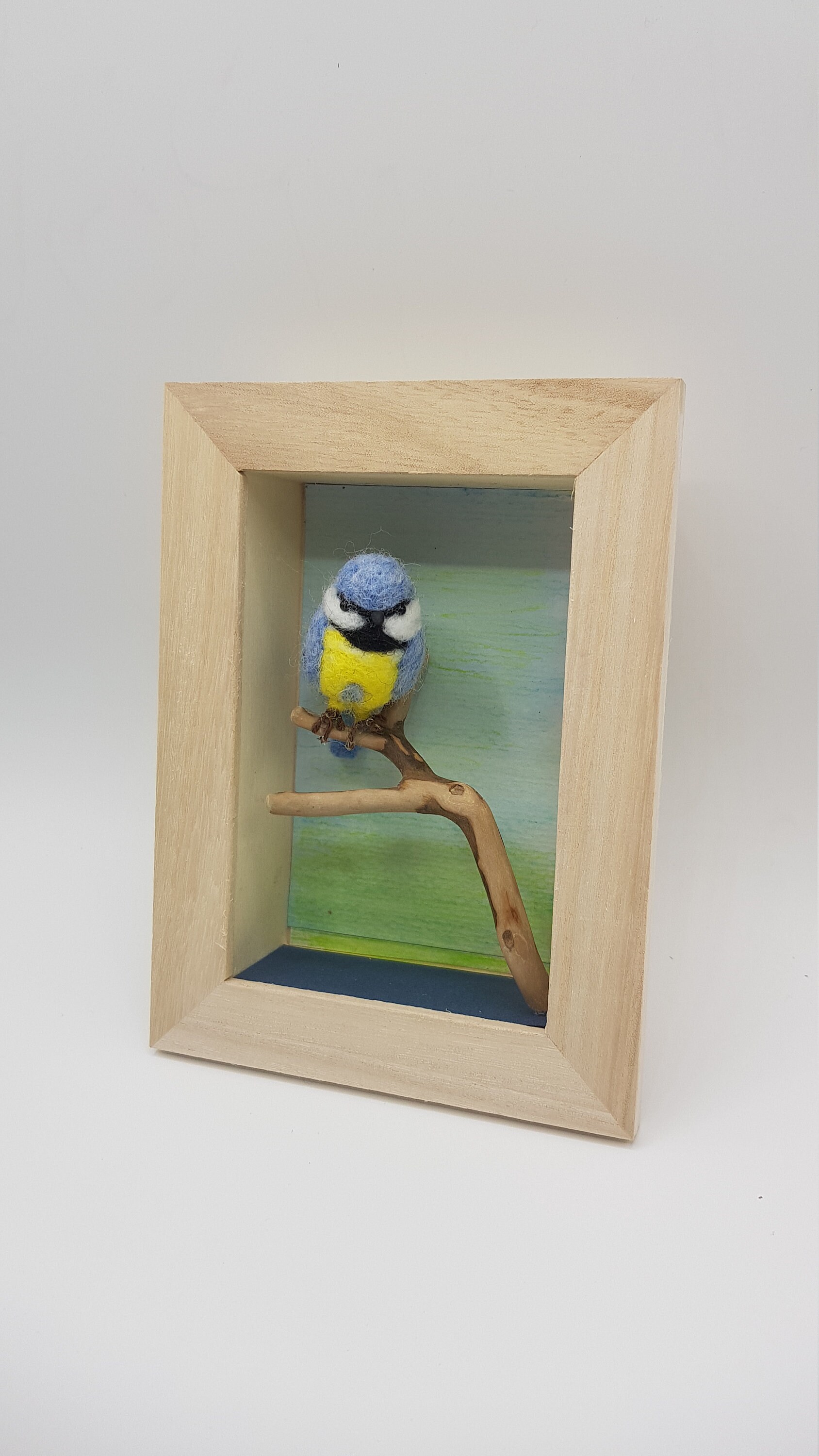 Mésange en Laine Feutrée Dans Un Cadre Relief.