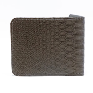May include: A brown leather wallet with a snakeskin pattern.