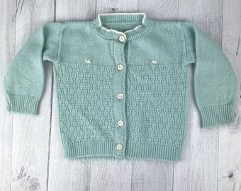 Teal Blue Cardigan Sweater with Two Small White Chicks, Ribbing on Neckline, Wrists and Hem, White Buttons Down Front, Design Down Front