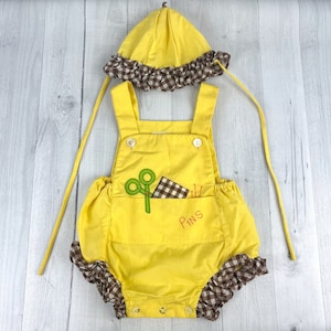 Vintage Romper with matching Bonnet in Yellow with Brown Gingham Print Ruffled Trim. Two Front Pockets with Pins, Scissors & Material Design
