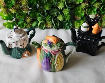 3 World Bazaar (WB) collectible mini teapot set with lid : whimsical dog under the table, black old-fashioned range; fruits and veggies
