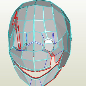May include: A 3D papercraft model of a face with a wide smile, featuring a geometric design with red and blue lines on a gray background.
