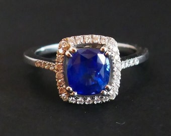 Ring Set With A Sapphire, Diamond Surroundings.