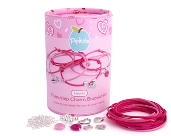 May include: Pink and red friendship charm bracelet kit from Pipkits. The kit includes six cords, silver charms, and pink beads. The kit is packaged in a pink tube with a heart design.