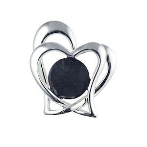 May include: Silver double heart photo frame with a round black photo insert.