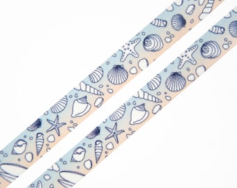 May include: A blue and white ribbon with a seashell and starfish pattern. The ribbon has a gradient of blue and white colors.