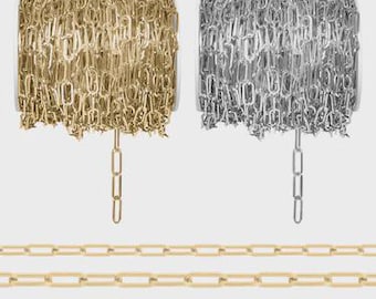 May include: Two spools of chain, one gold and one silver, are displayed above three parallel rows of gold chain. The chains have an elongated oval link design. The background is a plain, light gray.