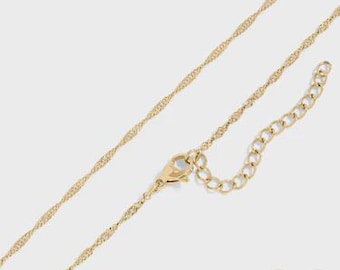 May include: A gold-colored necklace with a delicate, twisted chain design. The necklace features a lobster clasp closure and an adjustable chain for a customized fit. The chain is shown against a light gray background.