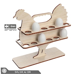 May include: A wooden egg holder shaped like a rooster, with two levels to hold eggs. The holder is made of light-colored wood and has a handle. The dimensions are 347mm x 120mm x 313mm, and it is 6mm thick. White eggs are placed in the holes.